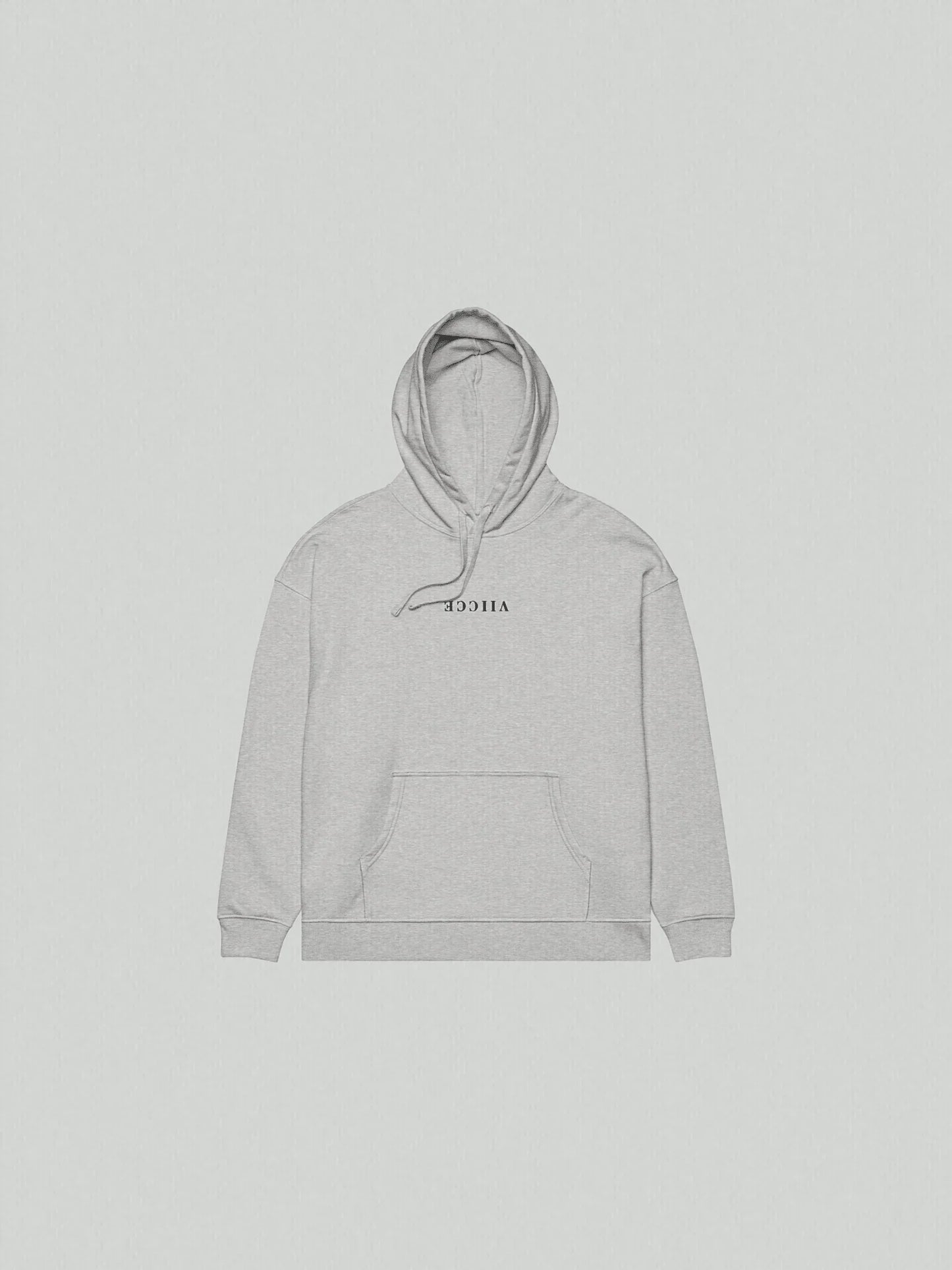 VIICCE Core Heavyweight Hoodie in Concrete Gray. Hoodie flat lay on the floor with Viicce written upside down in the center. Minimalist streetwear style. Studio photo.