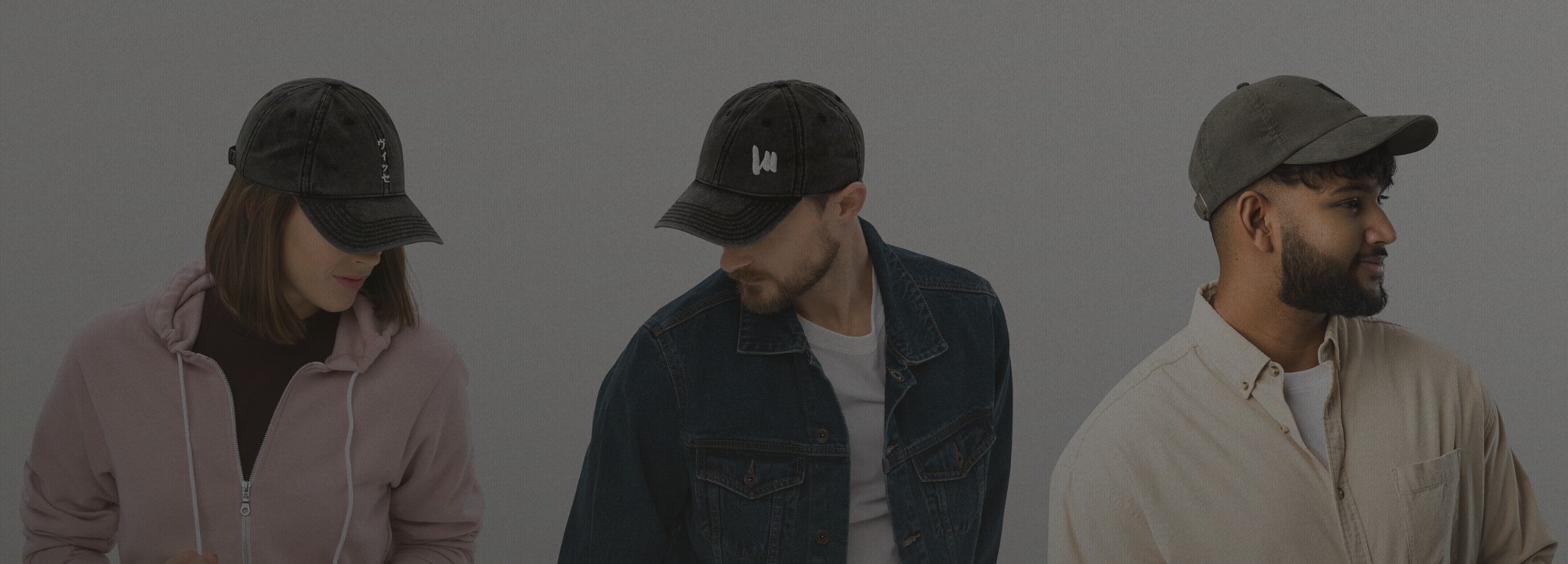 Three diverse models wearing VIICCE distressed baseball caps in a studio setting. Urban streetwear headwear collection.