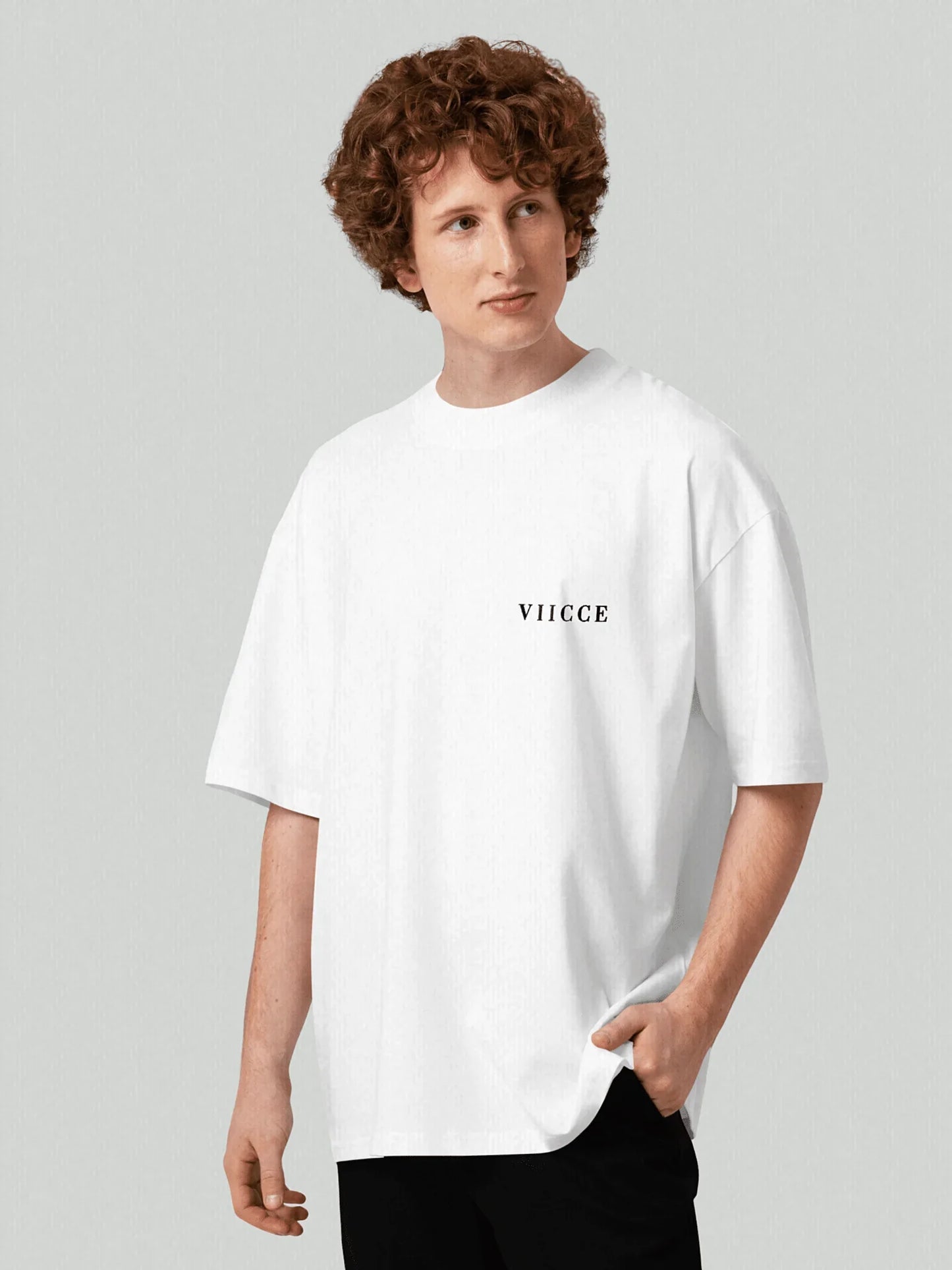 VIICCE Essence Tee - Pure White. Men's boxy, oversized t-shirt with a viicce print on the left chest. Made from high-quality, heavyweight organic cotton. Studio photo.