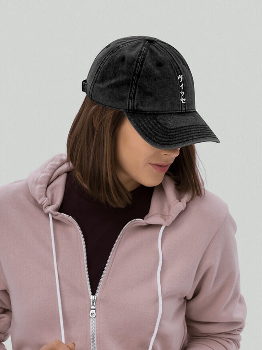 Female model wearing Katakana Cap VIICCE dad hat style cap with distressed finish