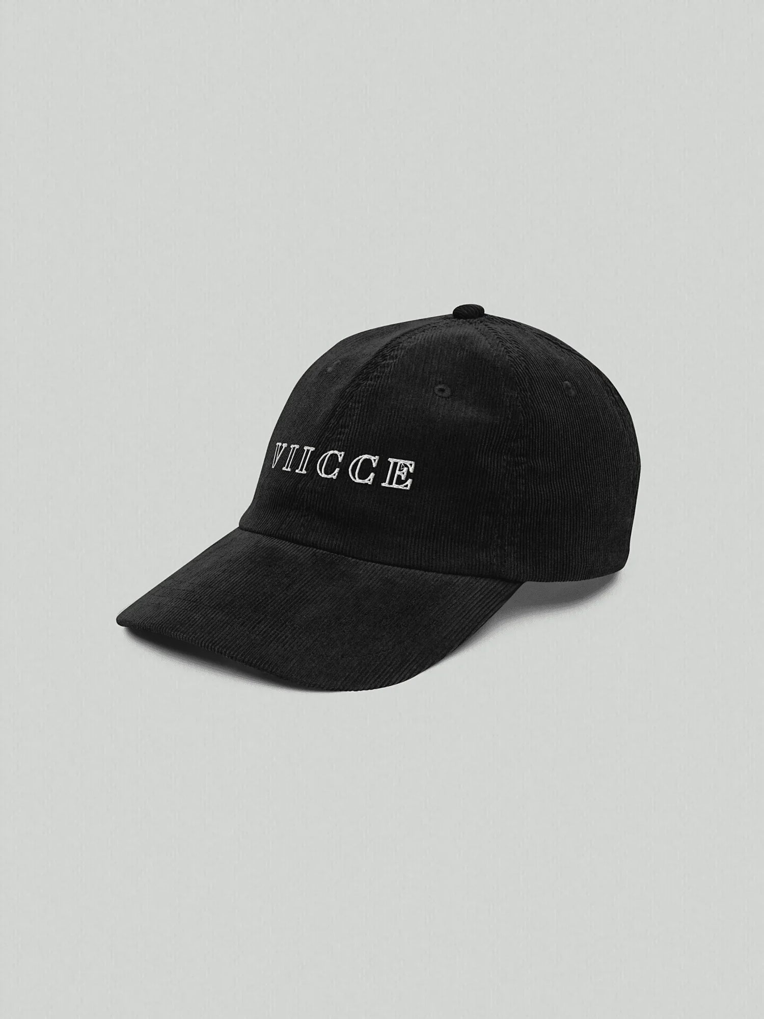 Black VIICCE cap with white embroidered logo, minimalist luxury streetwear design