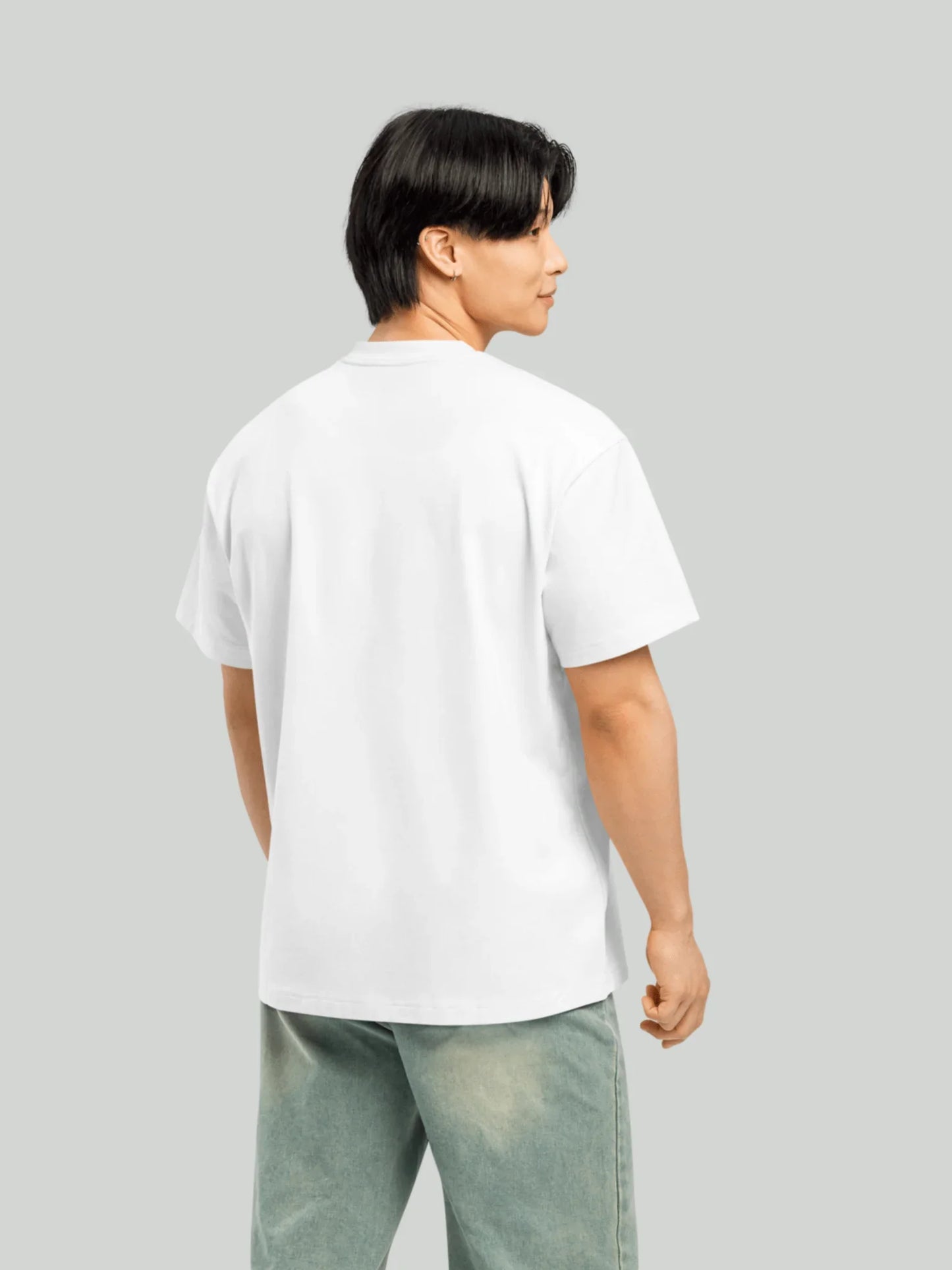 Origin Tee - Ash White Oversized. Back view of Viicce's oversized ash-white T-shirt. Made from high-quality organic cotton. Studio photo.
