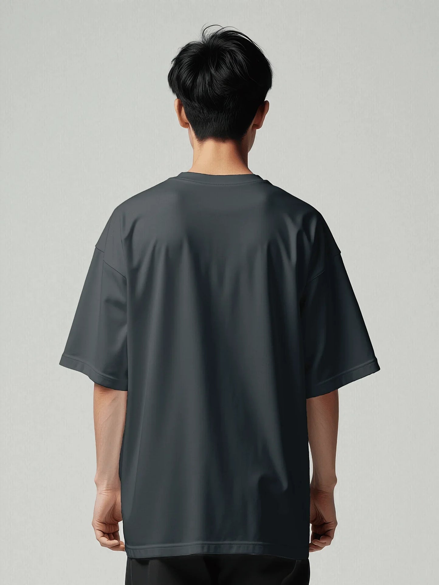 Origin Tee - Navy Oversized Blazer. Back model with oversized T-shirt with viicce written upside down on the chest. Made from high-quality organic cotton. Studio photo.