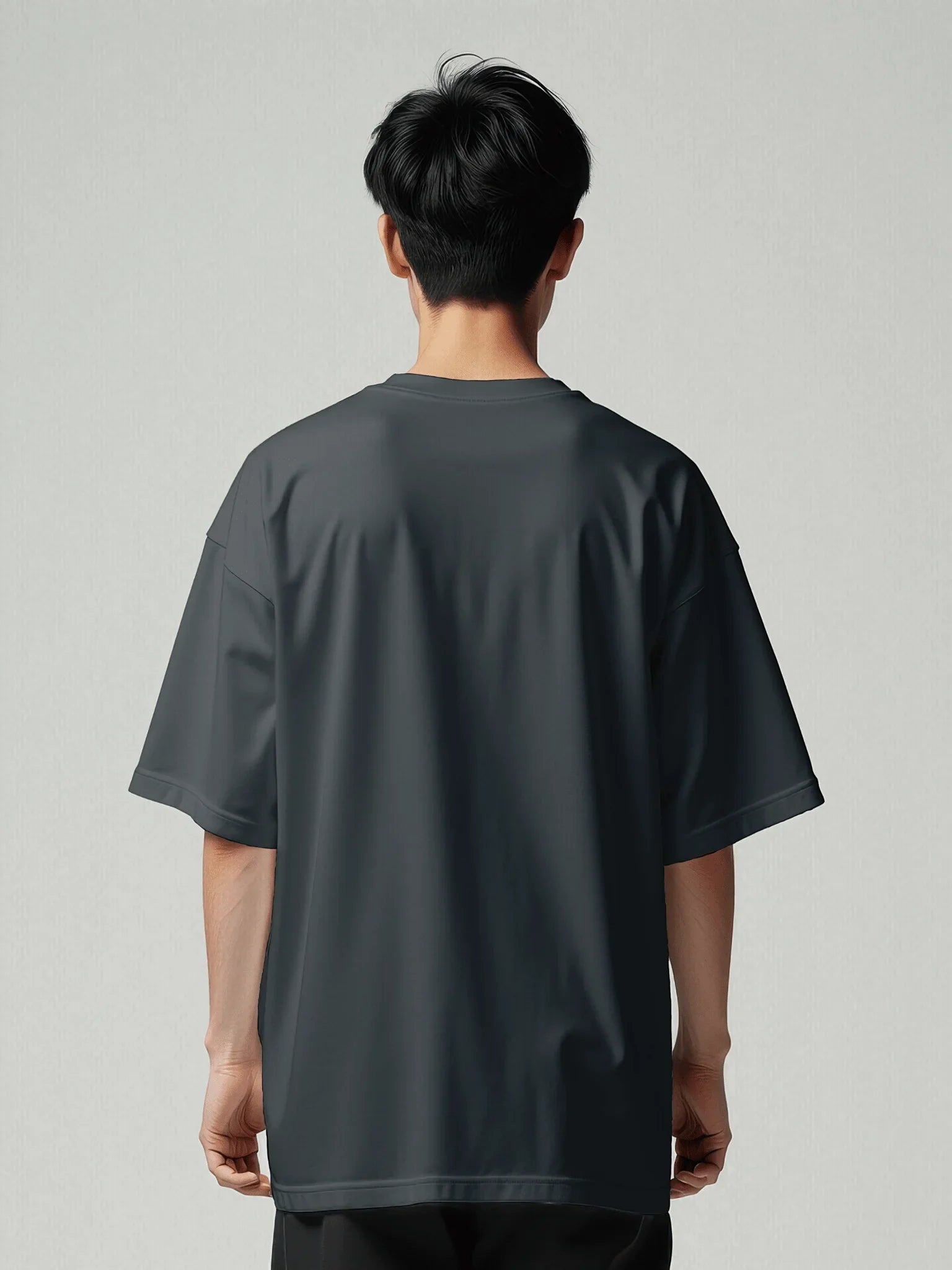 Origin Tee - Navy Oversized Blazer. Back model with oversized T-shirt with viicce written upside down on the chest. Made from high-quality organic cotton. Studio photo.