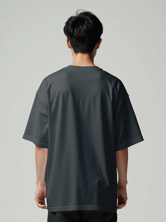 Origin Tee - Navy Oversized Blazer. Back model with oversized T-shirt with viicce written upside down on the chest. Made from high-quality organic cotton. Studio photo.