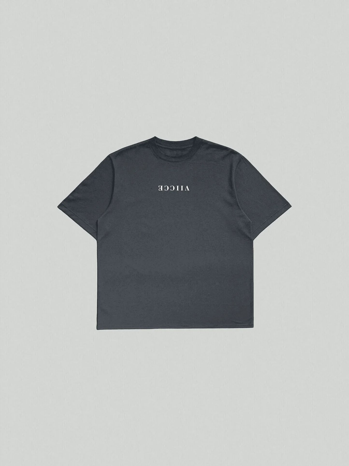 Origin Tee - Navy Oversized Blazer. Oversized T-shirt laid flat on the floor with “viicce” written upside down on the chest. Made from high-quality organic cotton. Studio photo.