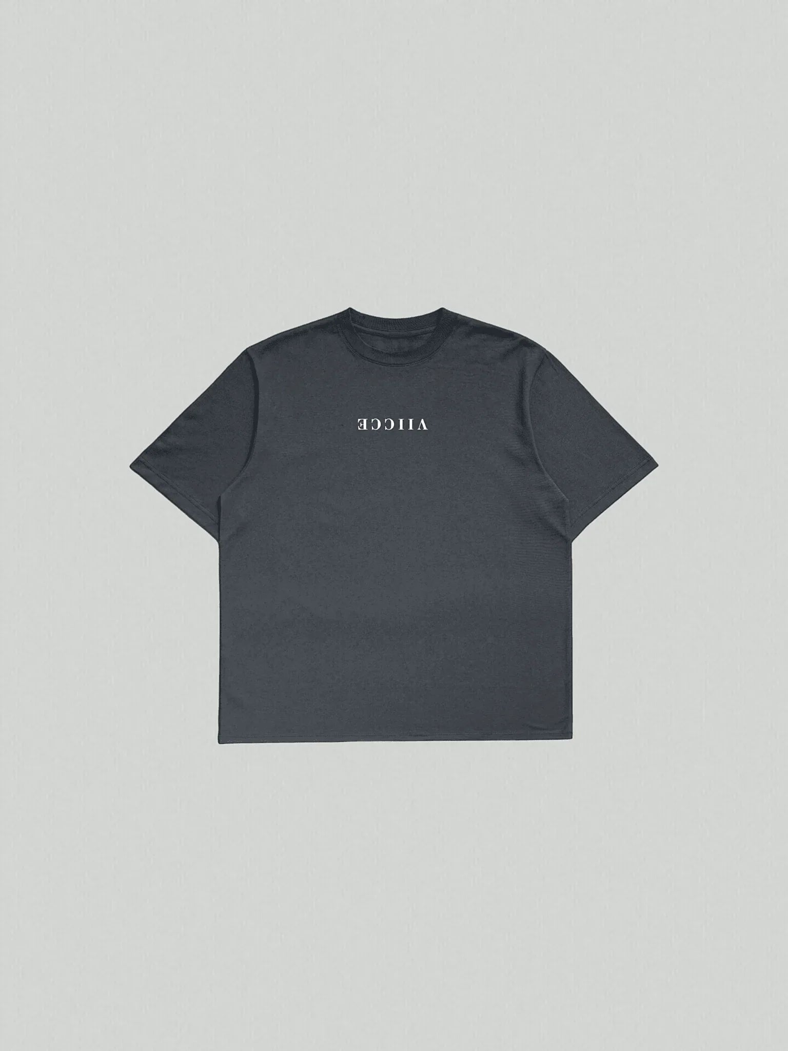 Origin Tee - Navy Oversized Blazer. Oversized T-shirt laid flat on the floor with “viicce” written upside down on the chest. Made from high-quality organic cotton. Studio photo.