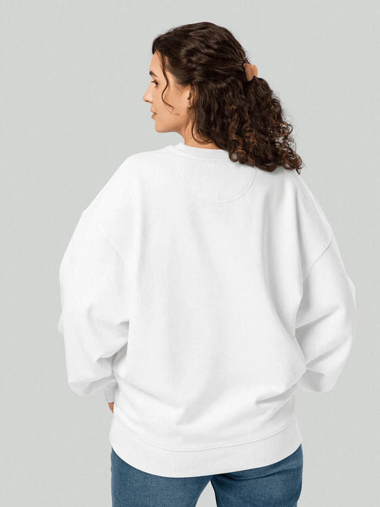 VIICCE Signature Sweatshirt in Bone White. Female model from behind wearing an oversized boxy cut sweatshirt with the minimalist VIICCE logo printed on the left chest.