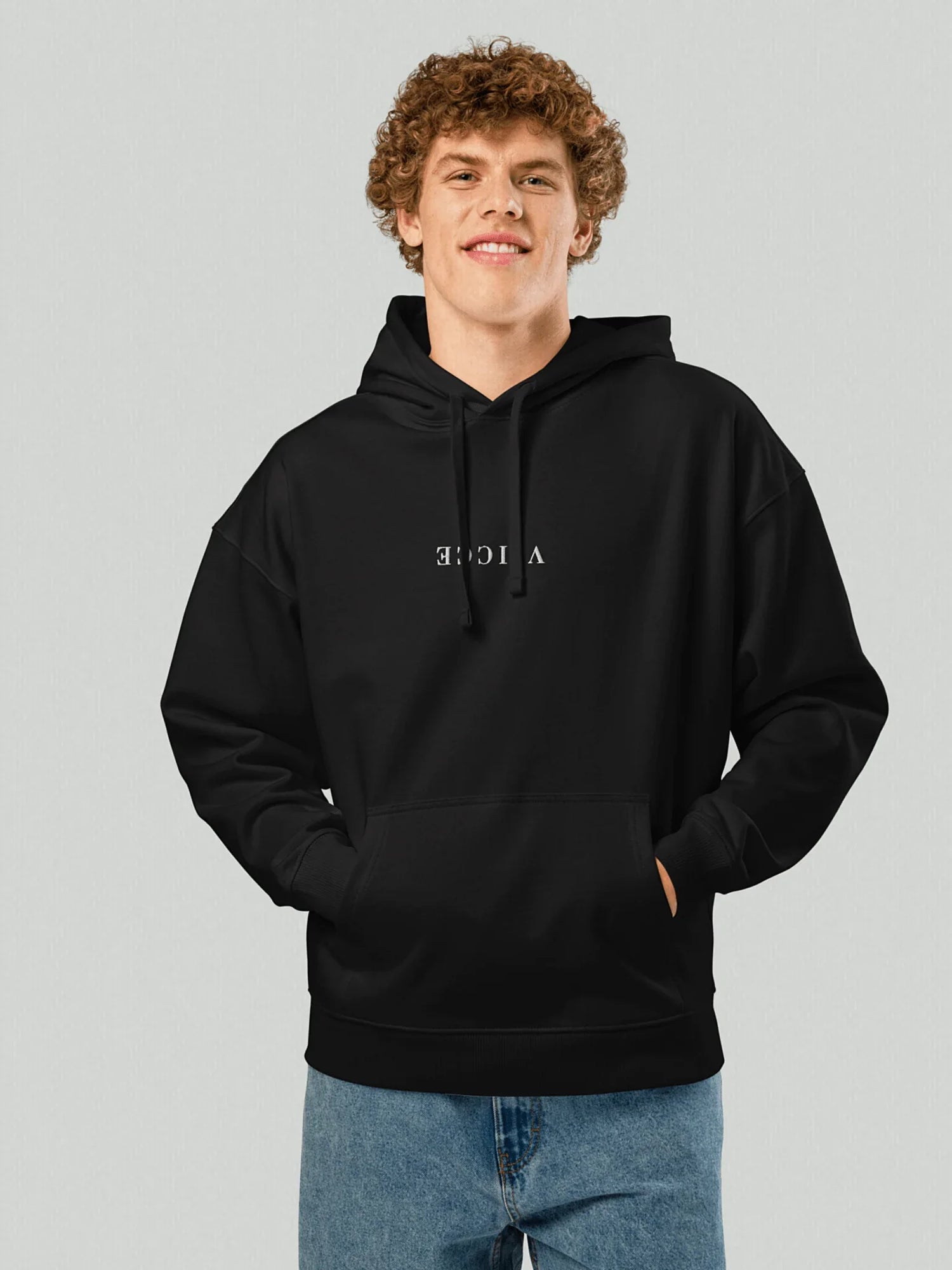 VIICCE Stealth Hoodie in Jet Black. Men's model with "VIICCE" written in reverse on the chest. Regular fit. Made with high-quality cotton.
