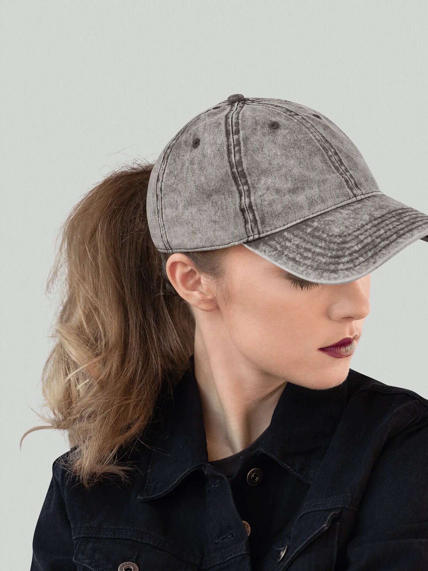 Female model wearing a charcoal gray vintage cap VIICCE urban aesthetic