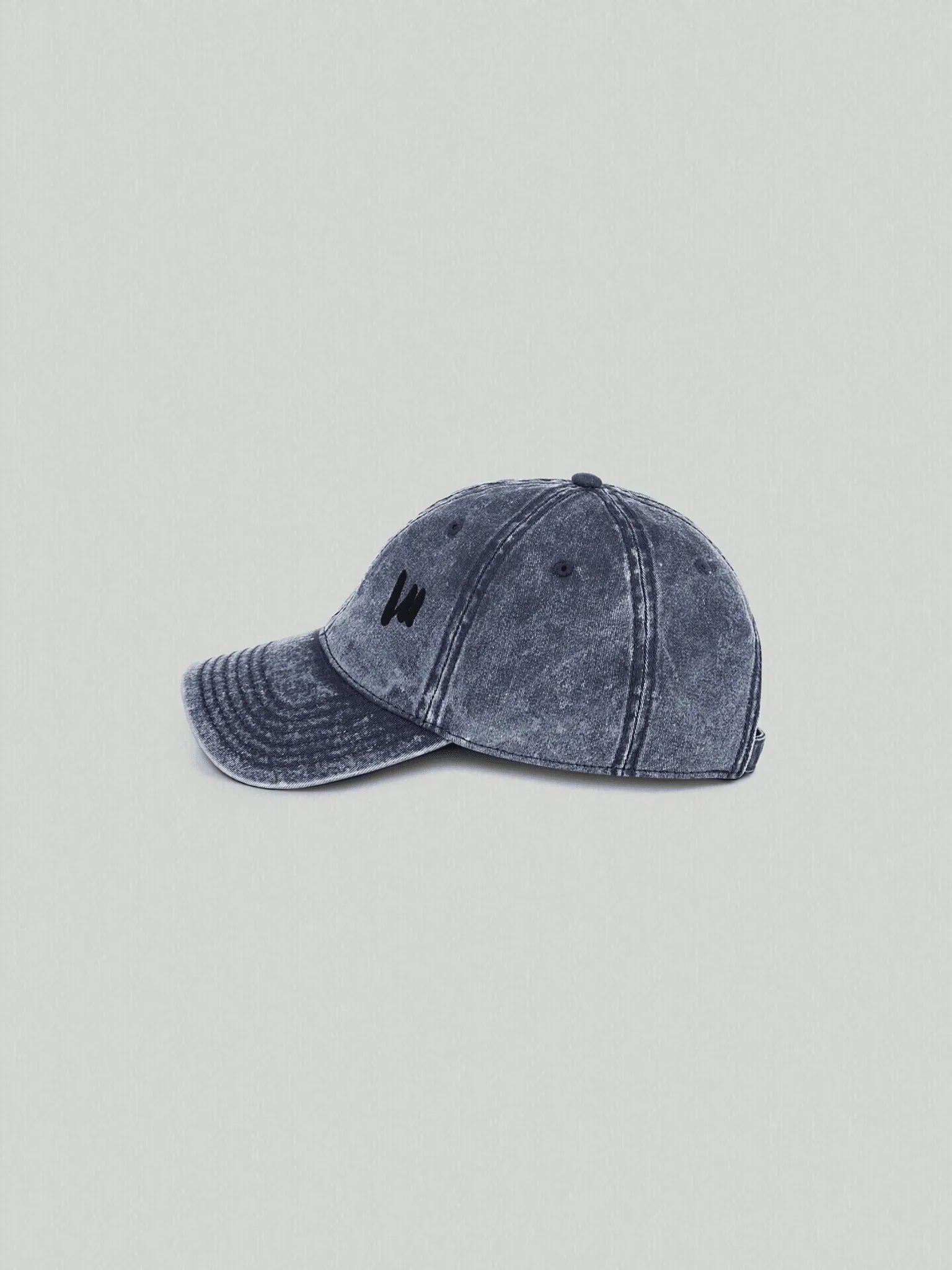 Side view of vintage blue VIICCE cap showing detail of embroidered logo